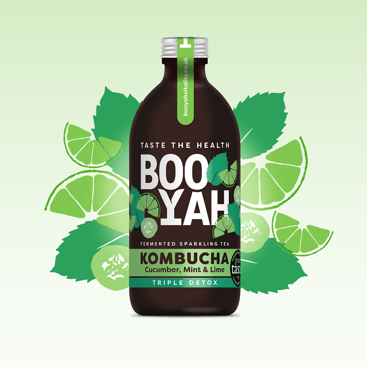 A bottle of Booyah Cucumber, Mint & Lime Kombucha with a dark brown body and a green cap. The label features the text 'Taste the Health' at the top, 'BOOYAH' in large white letters in the center, and 'KOMBUCHA Cucumber, Mint & Lime Triple Detox' in green and black at the bottom. The background shows stylized illustrations of lime slices, cucumber slices, and mint leaves on a gradient light green to white backdrop
